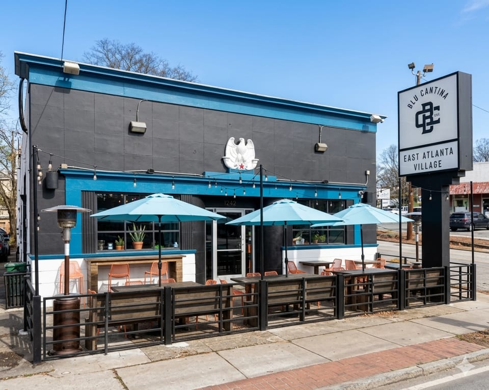 Blu Cantina restaurant exterior with black and blue facade, outdoor patio seating, and a large sign.